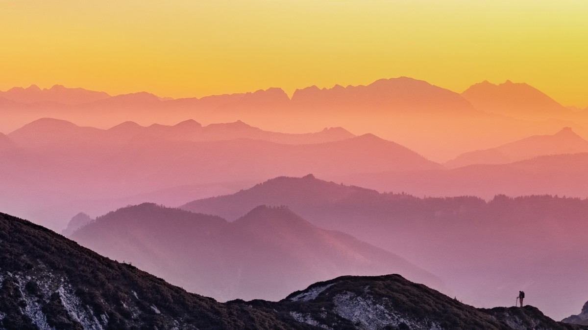 Man hiking in mountains at dusk