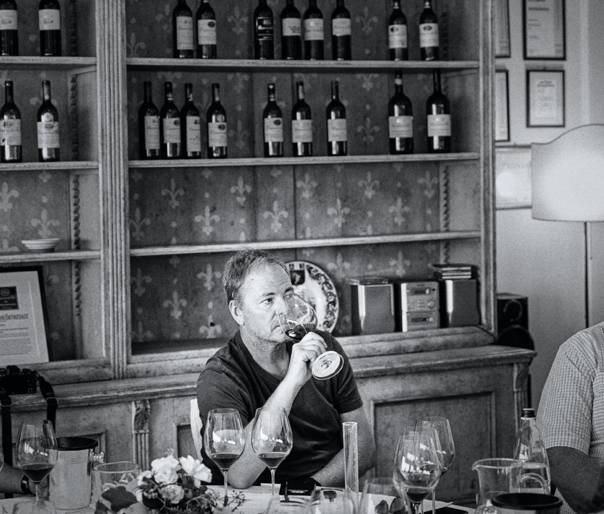 Michael Evans enjoying a glass of wine at Casanova di Neri winery in Montalcino, Tuscany