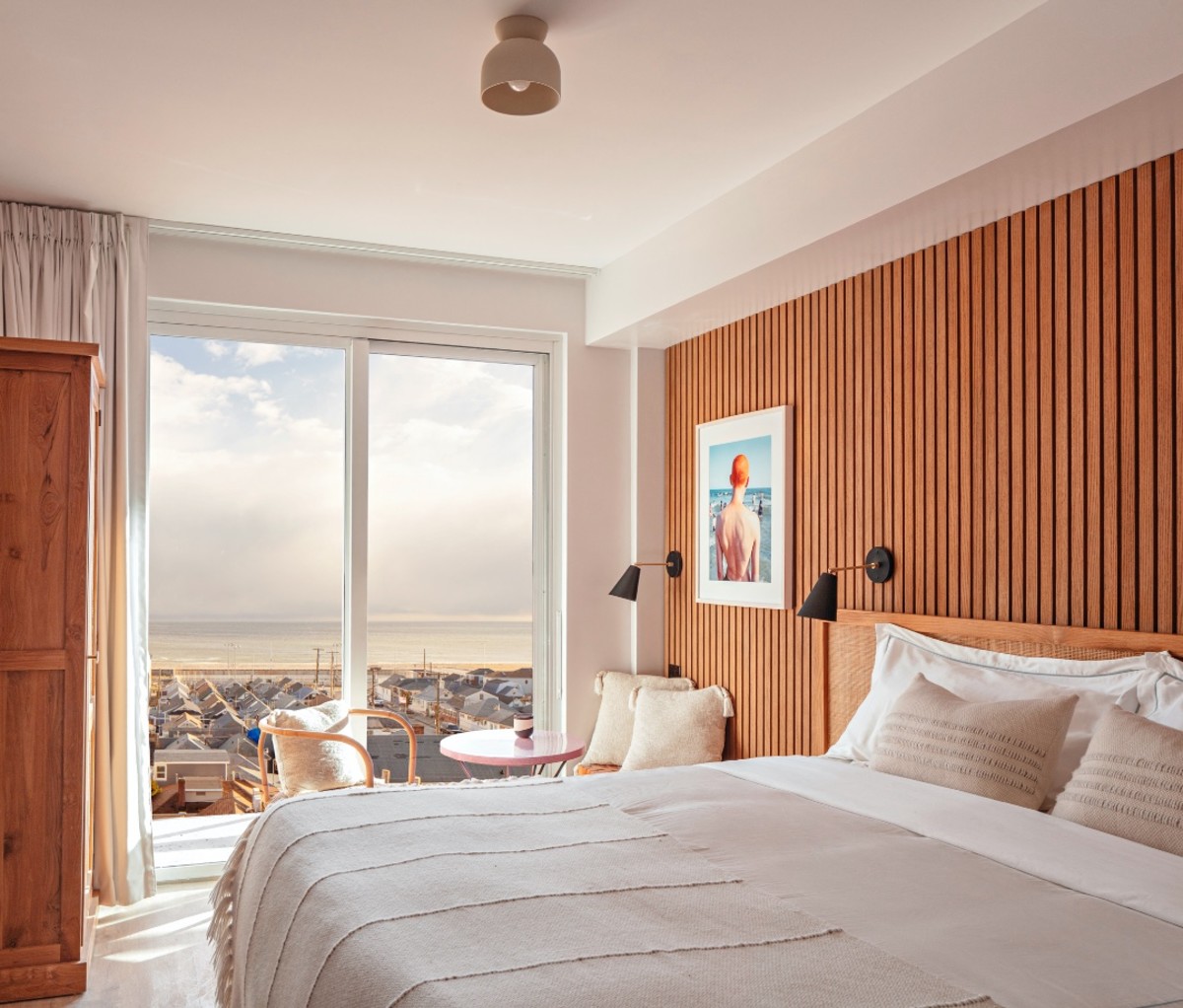 Bedroom with beach view at The Rockaway Hotel