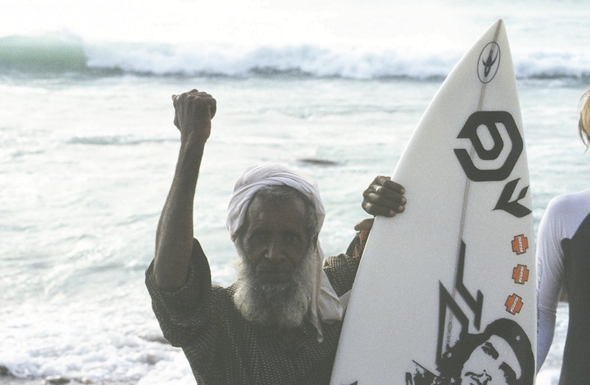Proud elder raises powerful fist in honor of surfing, Soqotra.