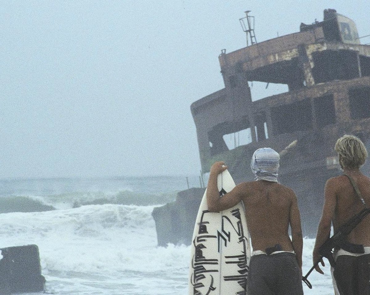 Finding waves breaking off rusty, jagged, menacing shipwrecked tanker post pirate invasion, near Nishtun.