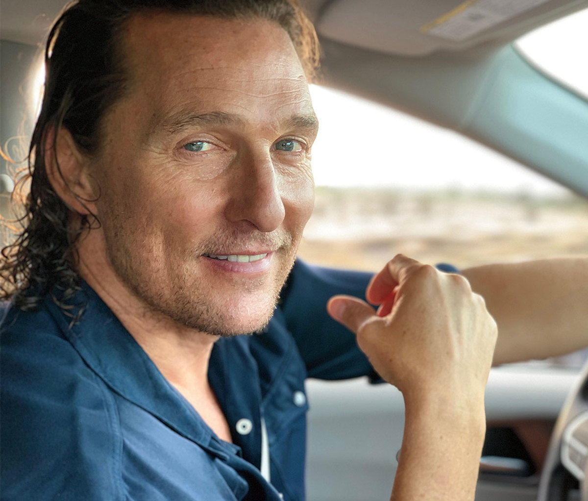 Matthew McConaughey driving his car in Texas