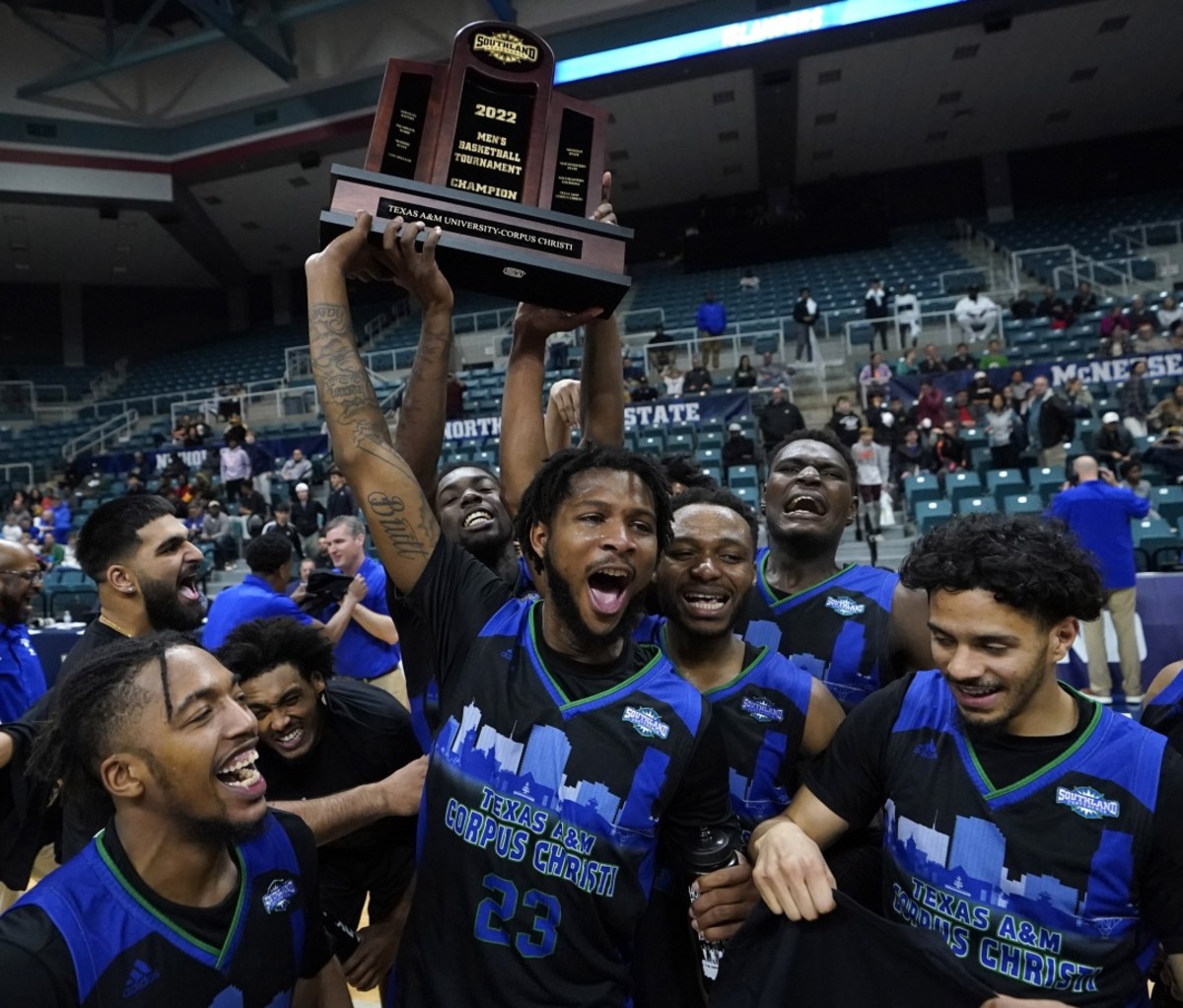 March Madness Upsets 2022 Texas A&M Corpus Christi players celebrate after winning the Southland Conference tournament