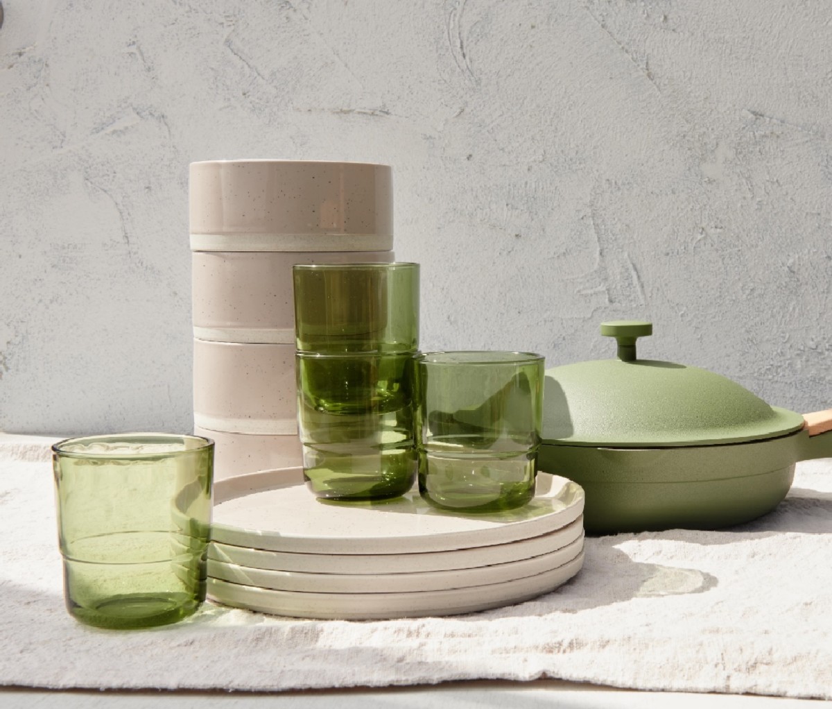 Our 4-pack place dinner with Always Pan in Sage, Dawn's drinking glasses, and steaming main dishes