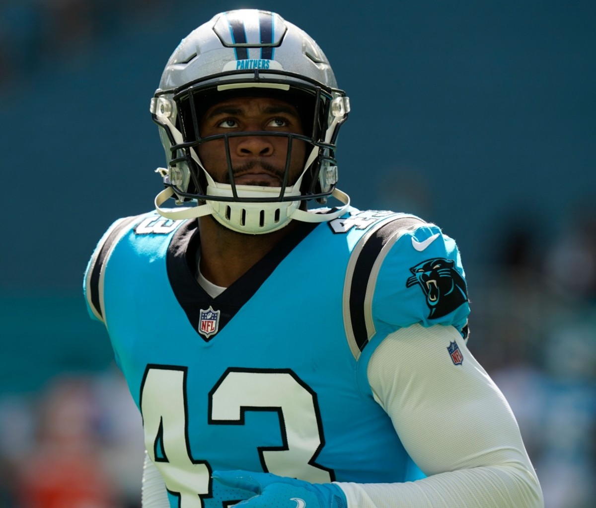 NFL Free Agents 2022 Haason Reddick in his Panthers uniform staring up and ahead