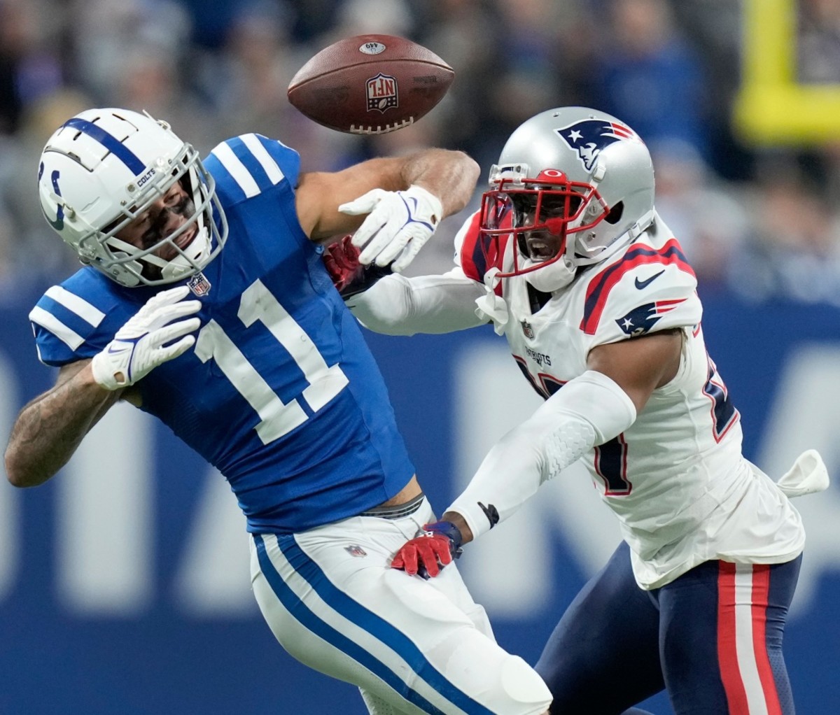 J.C. Jackson, right, breaks up a pass intended for Indianapolis Colts wide receiver Michael Pittman Jr. 