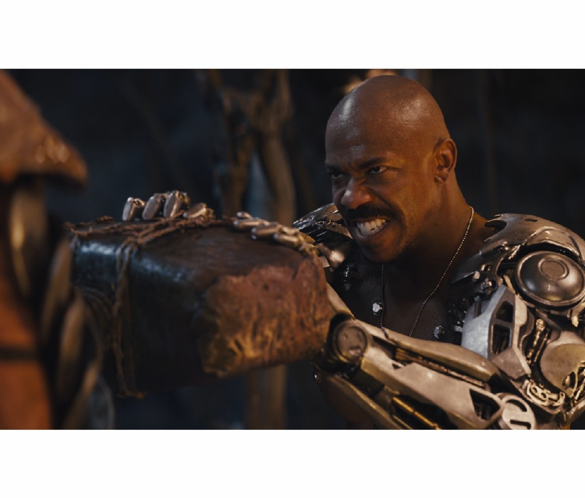Actor Mehkad Brooks shirtless with robotic arms for the video game movie