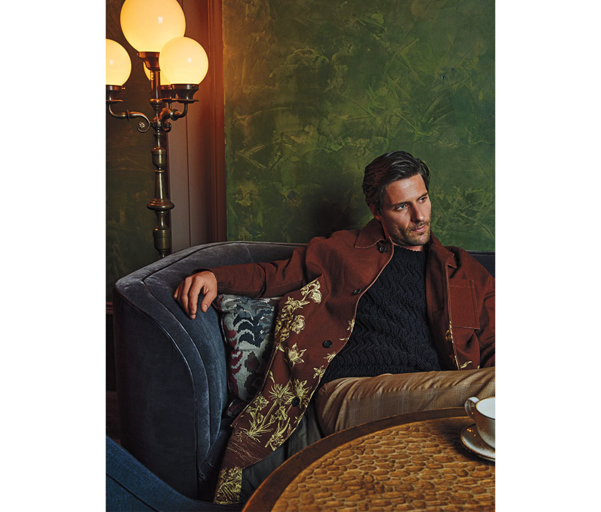 Caucasian man in his 30s reclining on sofa