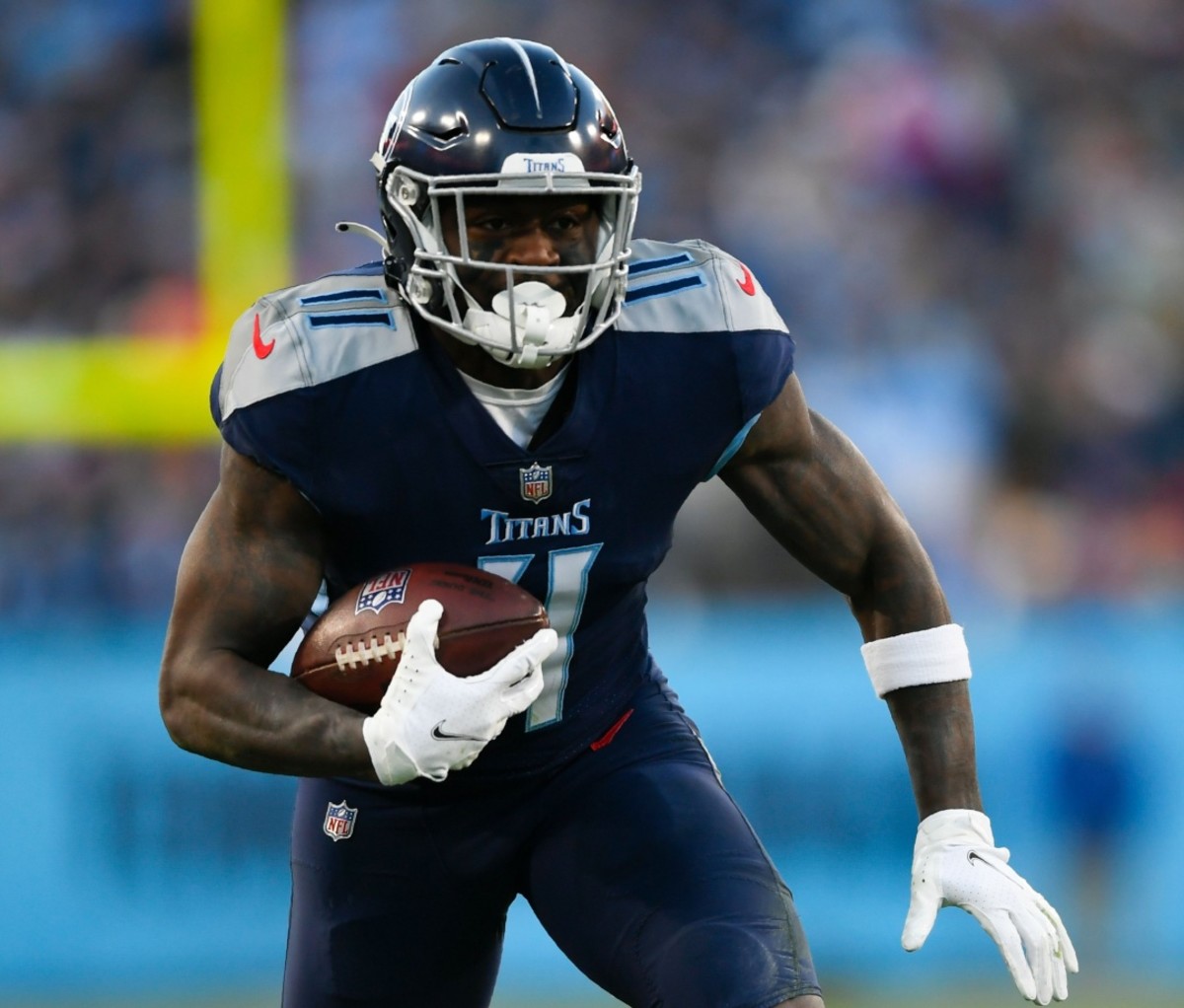A.J. Brown carrying the ball during a football game. NFL Draft 2022
