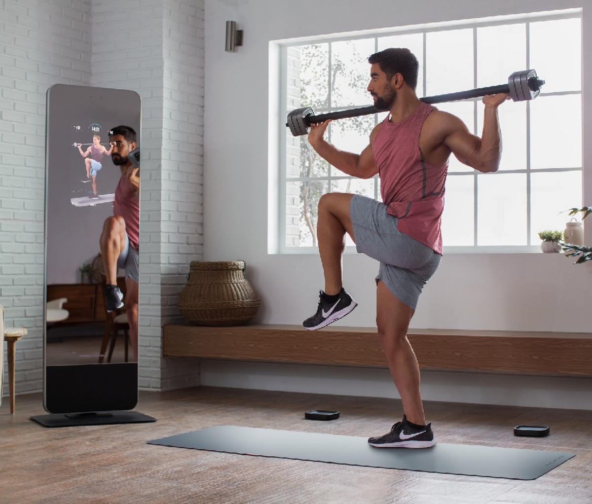 The Proform fitness mirror with barbell is great choice for building up your home gym.