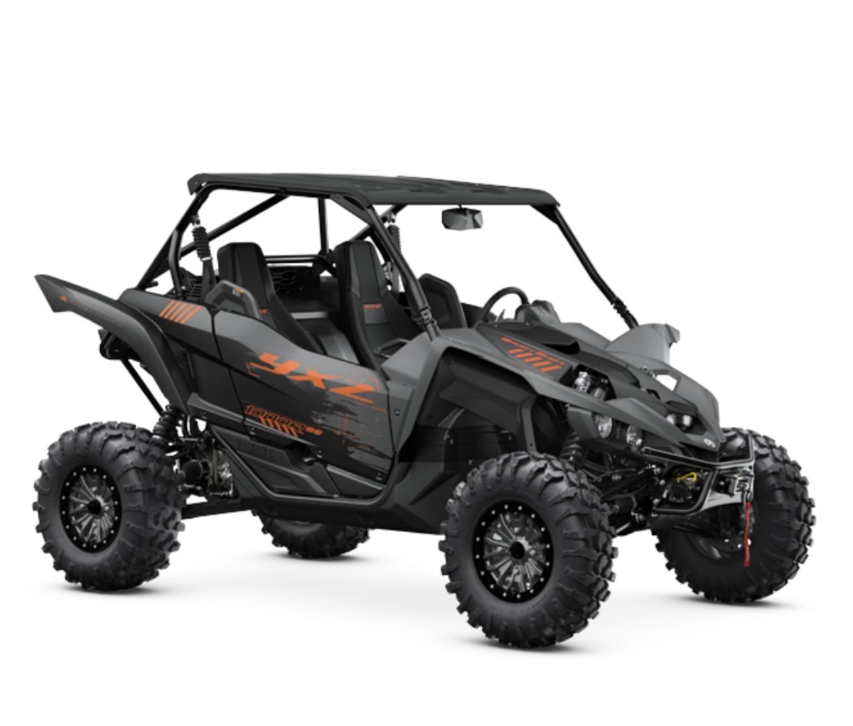 Yamaha YXZ1000R XT-R in black and orange on a white background. side-by-side UTVs