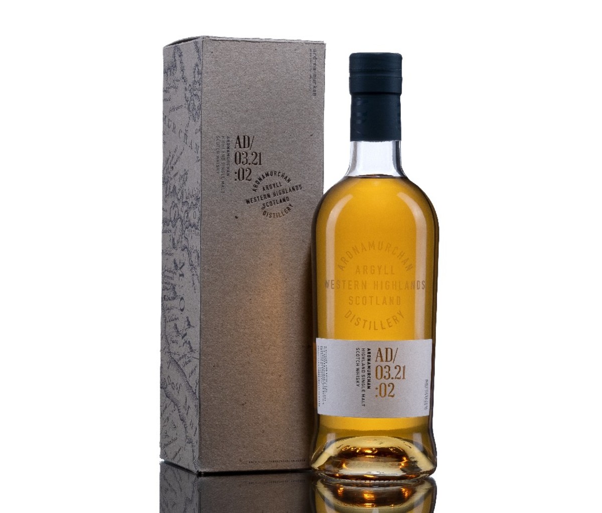 A box for Ardnamurchan Small Batch AD/03.21:01 scotch, standing next to a full bottle.