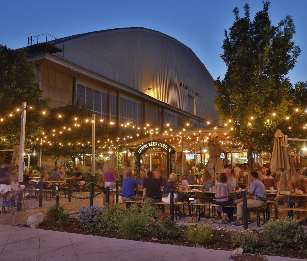 Housed in a revamped airplane hangar on a former Air Force base, the Oktoberfest-inspired Lowry Beer Garden is actually set in its very own park.
