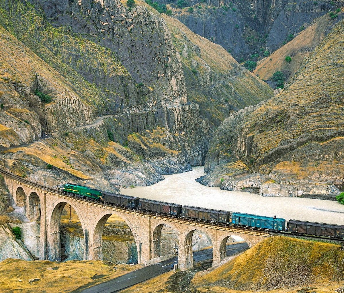 A train crosses a mountain bridge on the Trans-Iranian Railway.