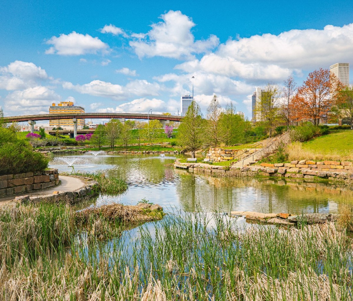 A view from Centennial Park in Tulsa with the city's skyline in the distance.