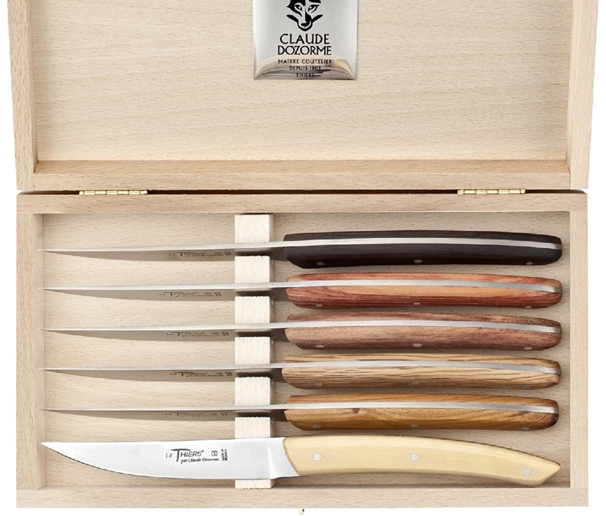 A box with the Claude Dozorme Thiers Mixed Wood Handle Stainless Steel Steak Knife Set.