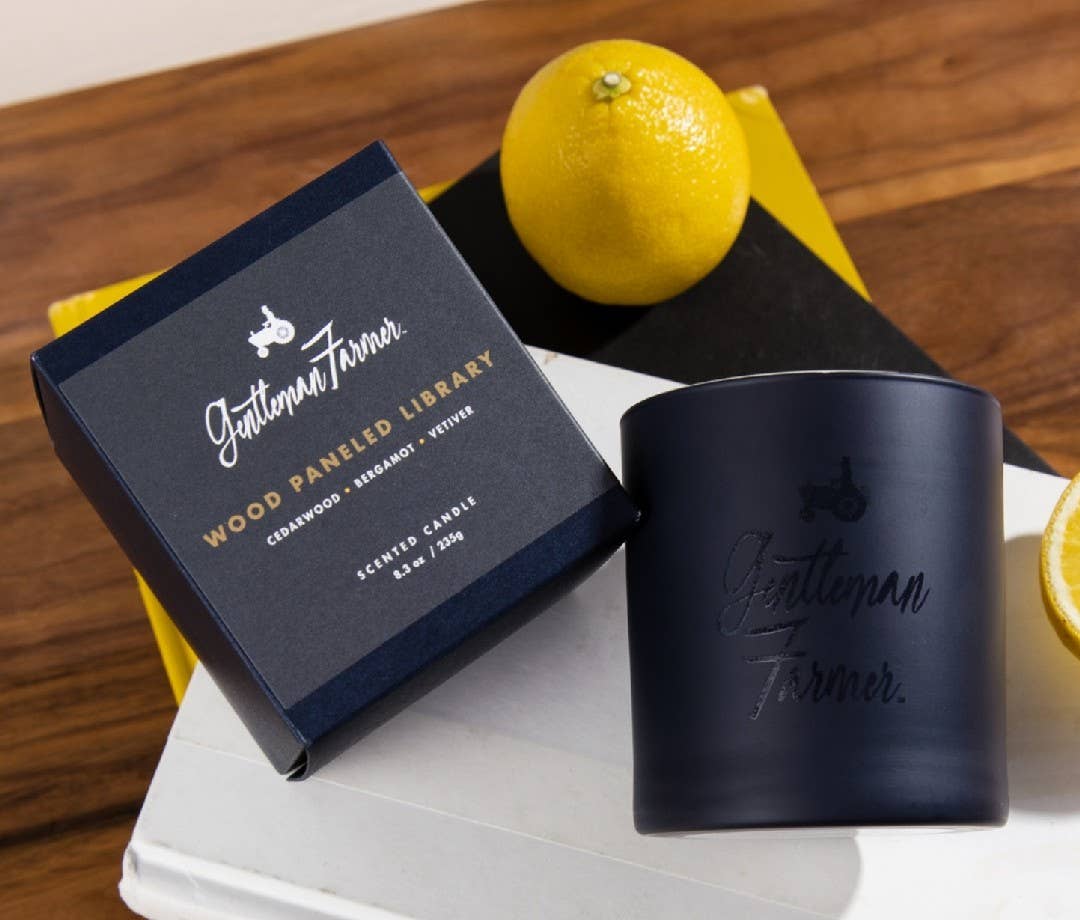 Chest, lemon, and wood-panelled library candle in the shape of a gentleman's farmer.