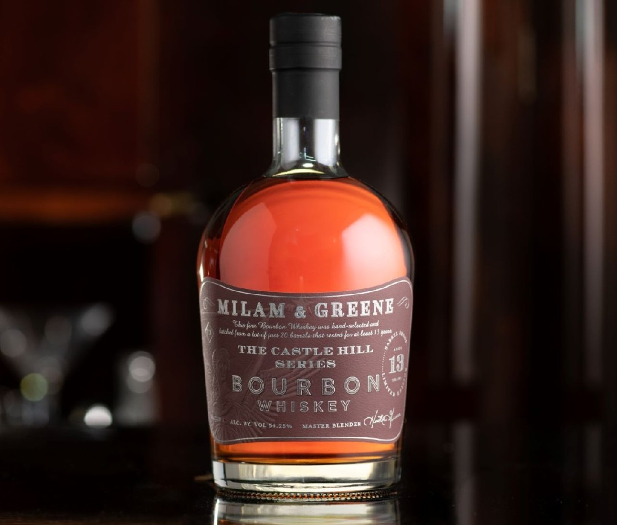 A bottle of Milam and Greene Castle Hill Series Bourbon.