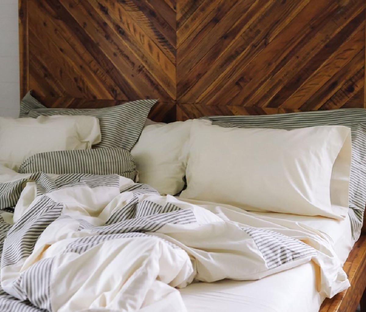 A bed with a Red Land Cotton Sheet set.