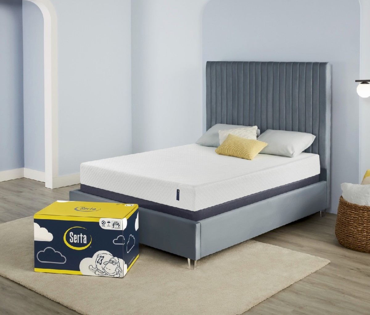An image of the Serta EZ Tote mattress on a bed, next to its box.