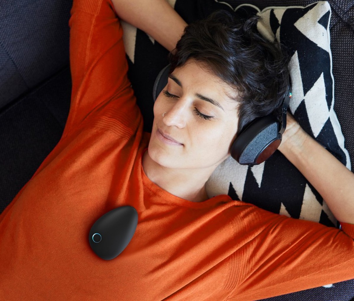 Woman lying down with Sensate relaxation device