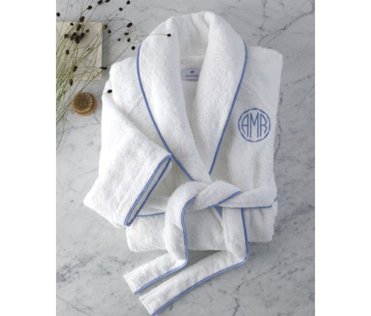 Folded white Matouk Cairo robe with a monagram