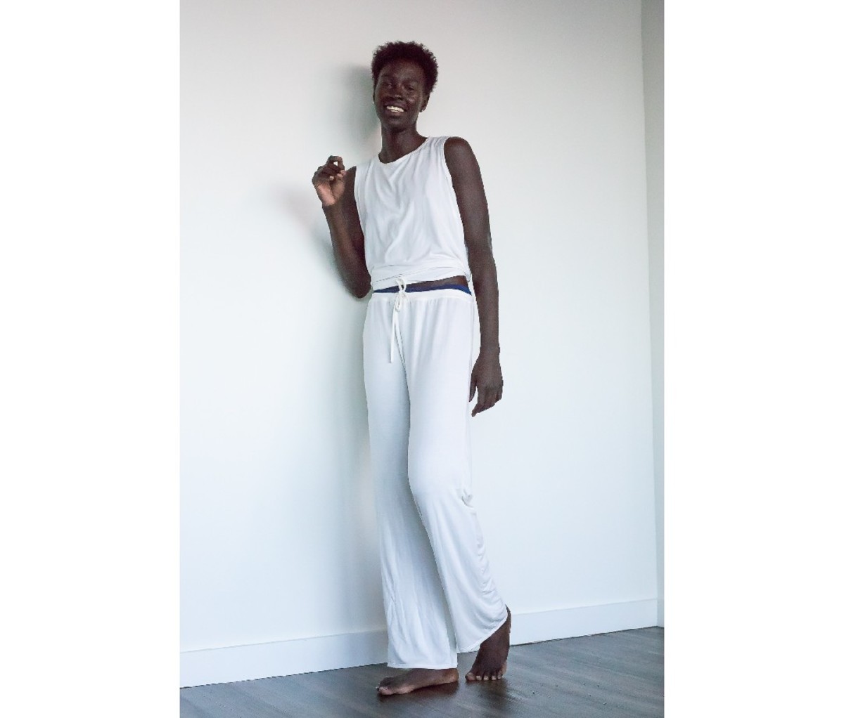 Woman wearing a white MADI Apparel Bamboo Lounge Set