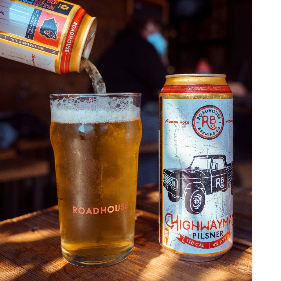 Roadhouse Highwayman Pilsner can pour into pint glass