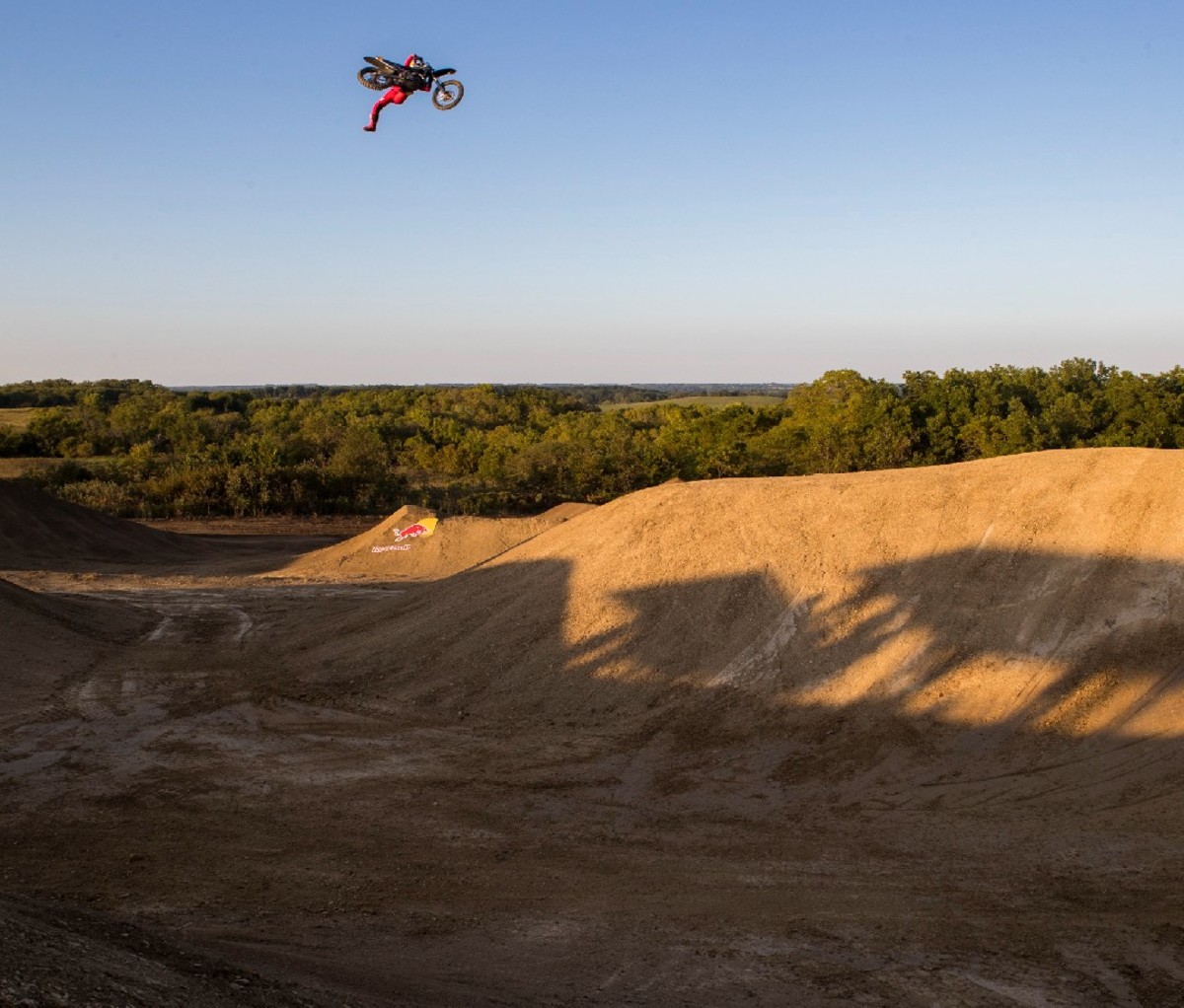 Motocross rider doing backflip on bike