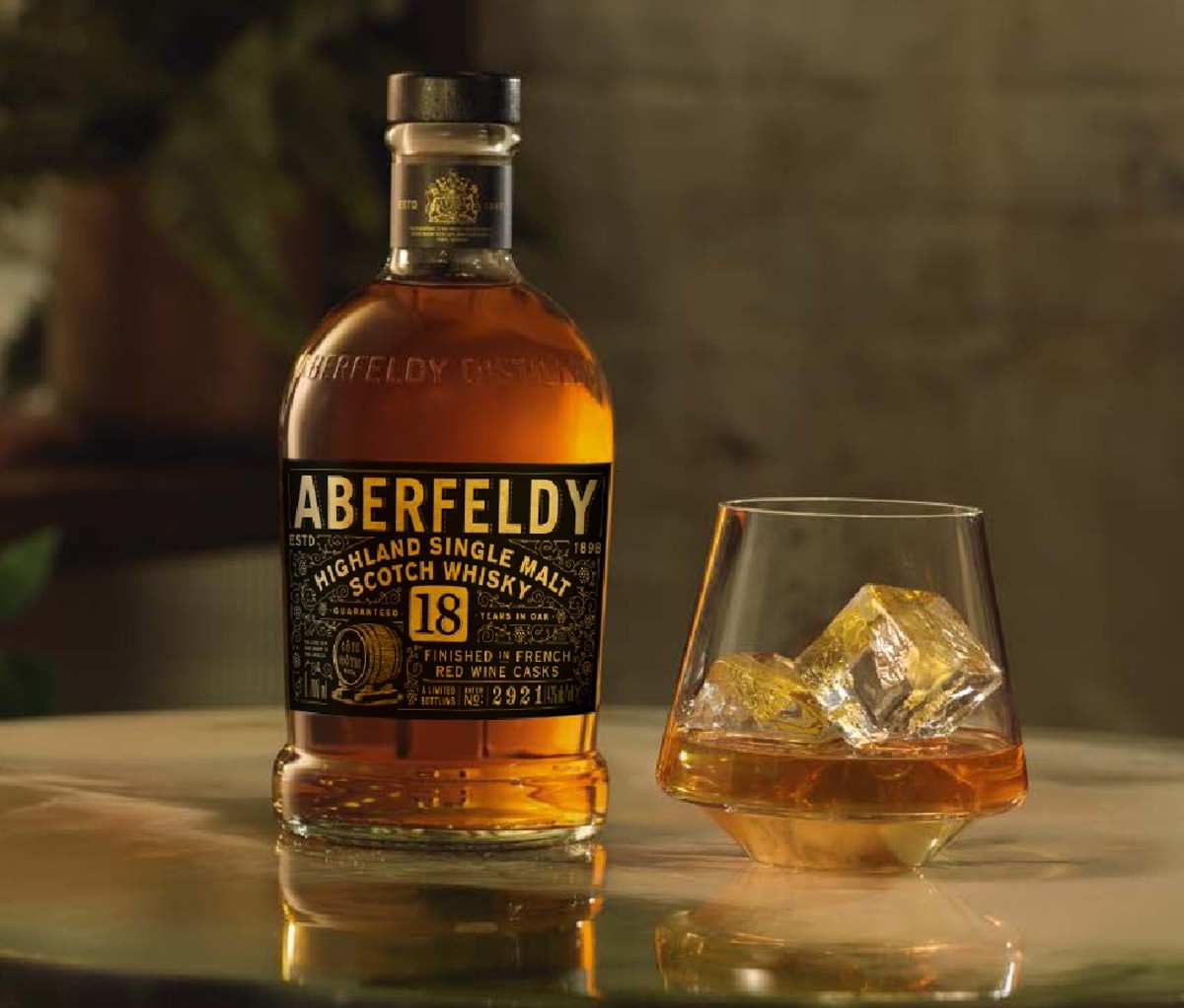 Bottle of Aberfeldy 18-Year-Old Red Wine Cask-Finished Single Malt Scotch Whisky beside filled glass