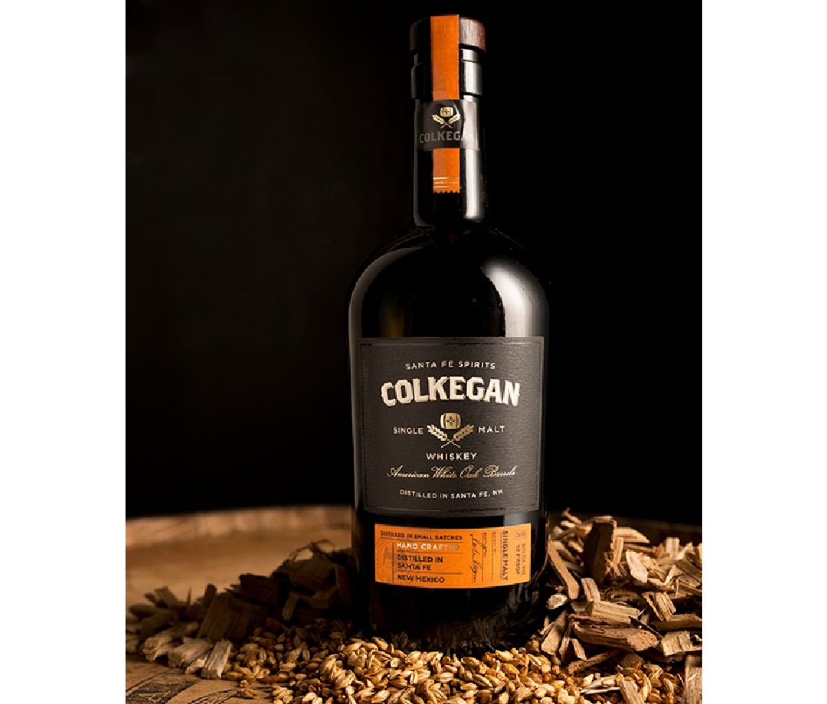 Bottle of Santa Fe Spirits Colkegan Single Malt Whiskey on a wooden gable