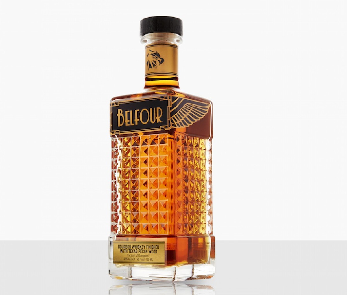 Square bottle of Belfour Spirits Pecan-Finished Bourbon on a gray surface