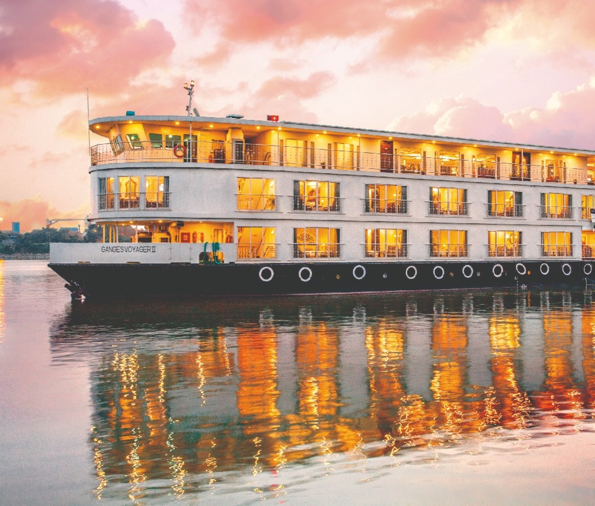 Light-up cruise ship at sunset