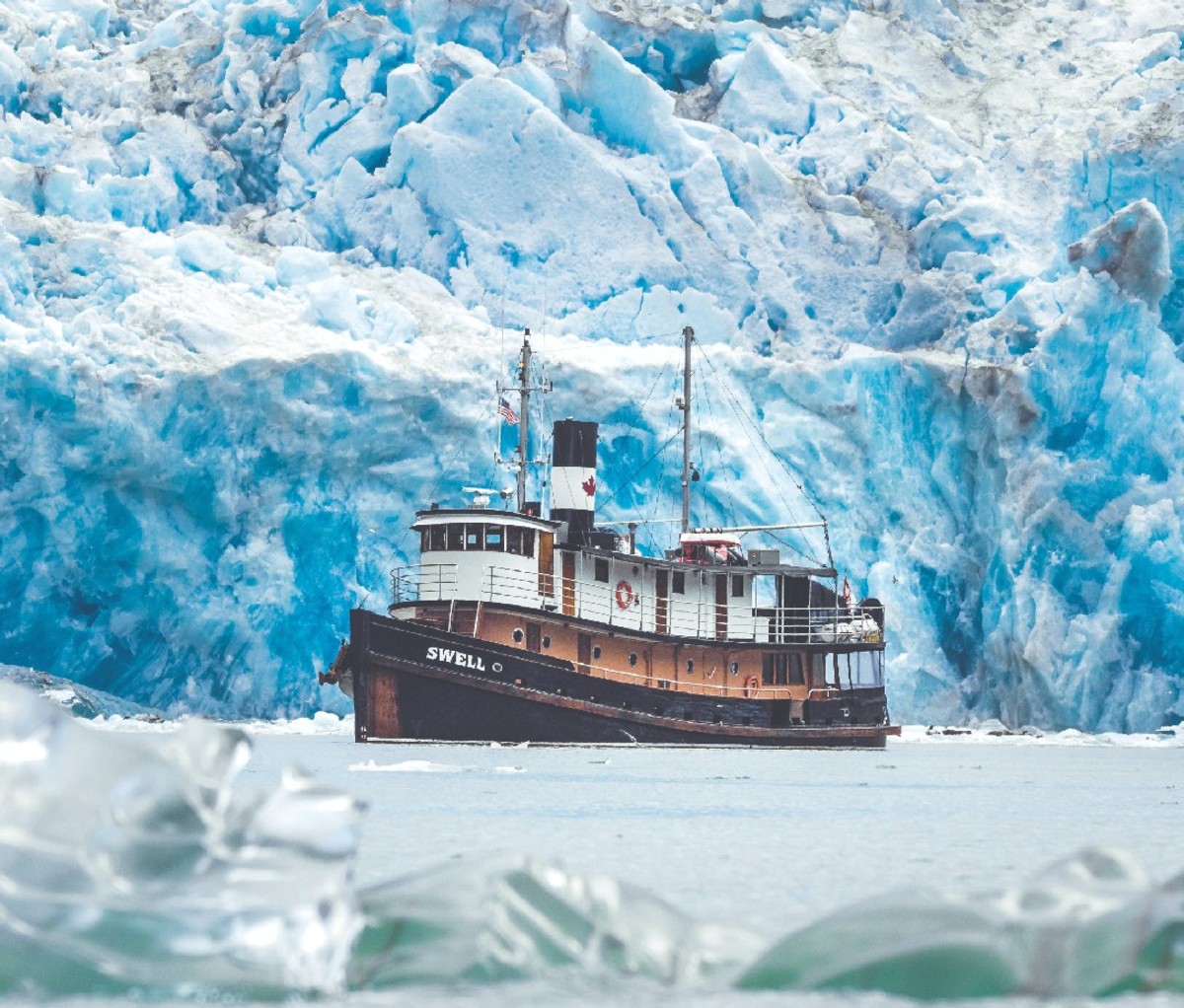 Cruise ship surrounded by icebergs