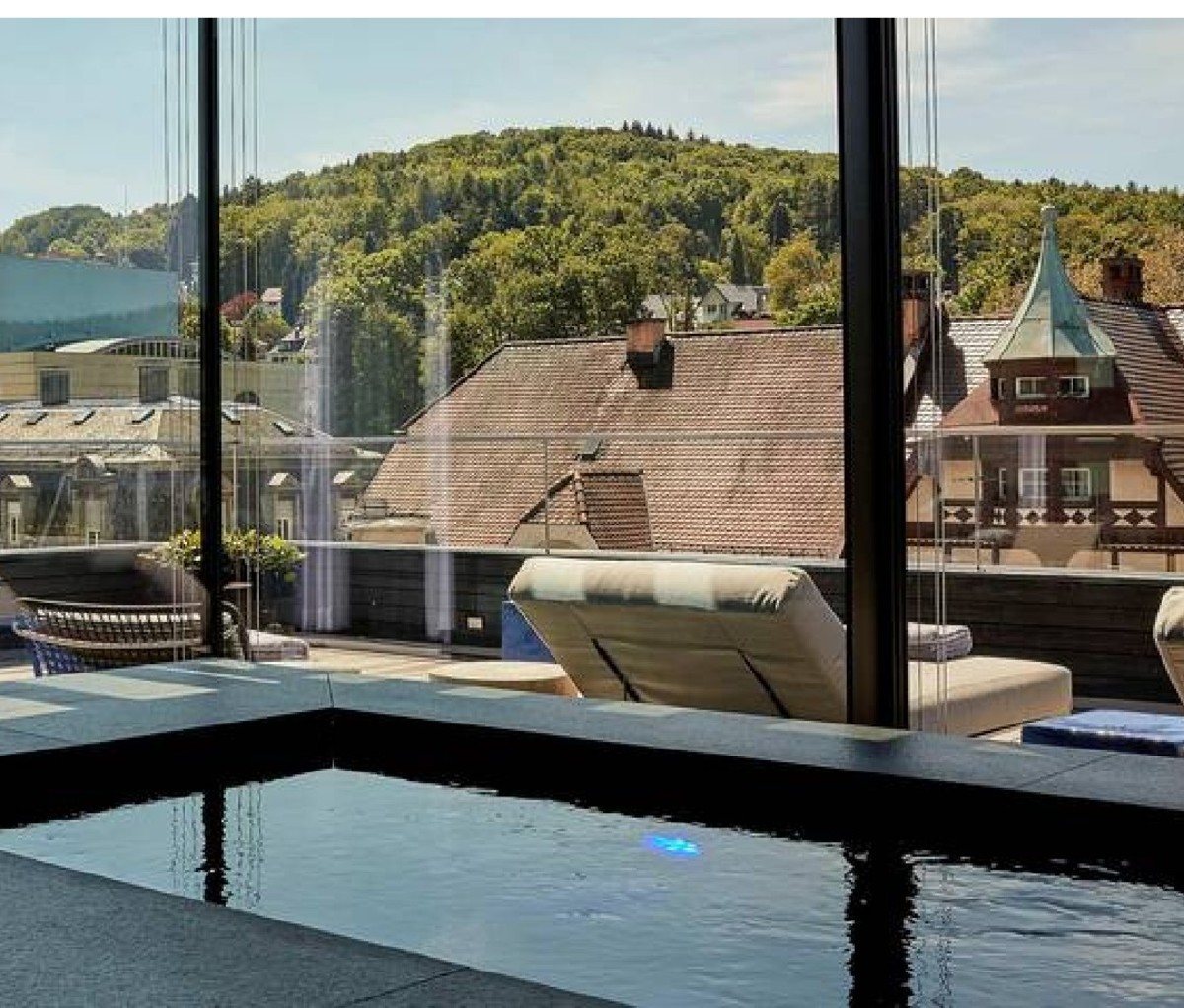 Indoor pool and exterior views at Roomers Baden-Baden hotel