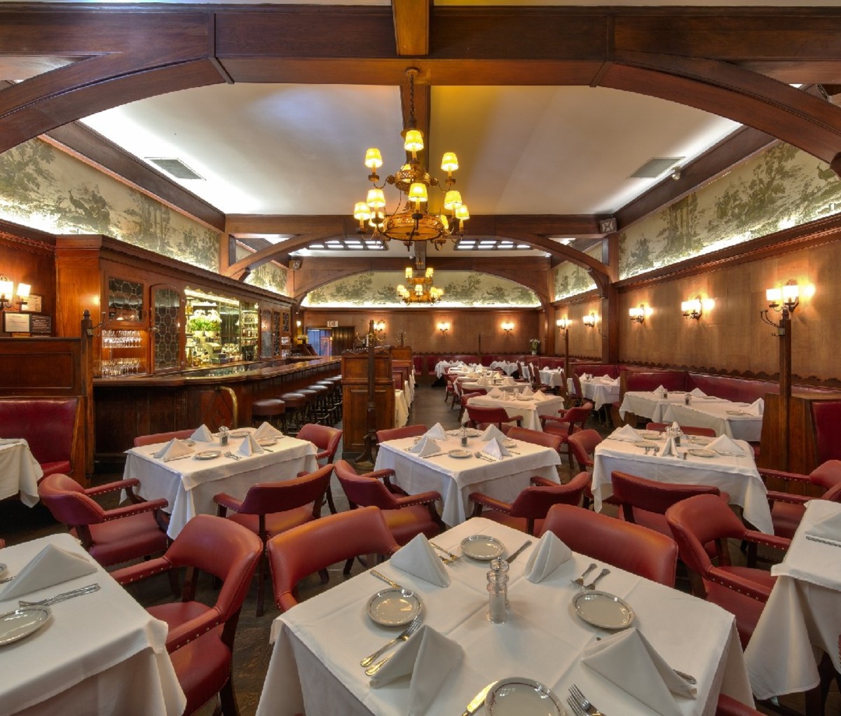 Experience Culinary Nirvana at These Iconic Restaurants 2 Interior of fine-dining restaurant with white table cloths