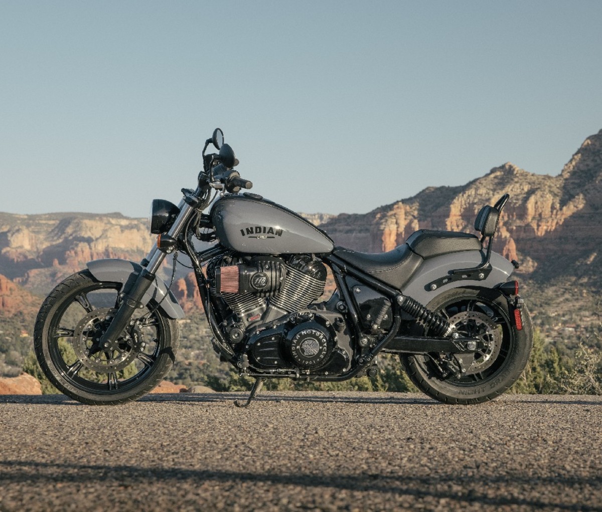 2022 Indian Dark Horse motorcycle parked beside the road with a mountain backdrop