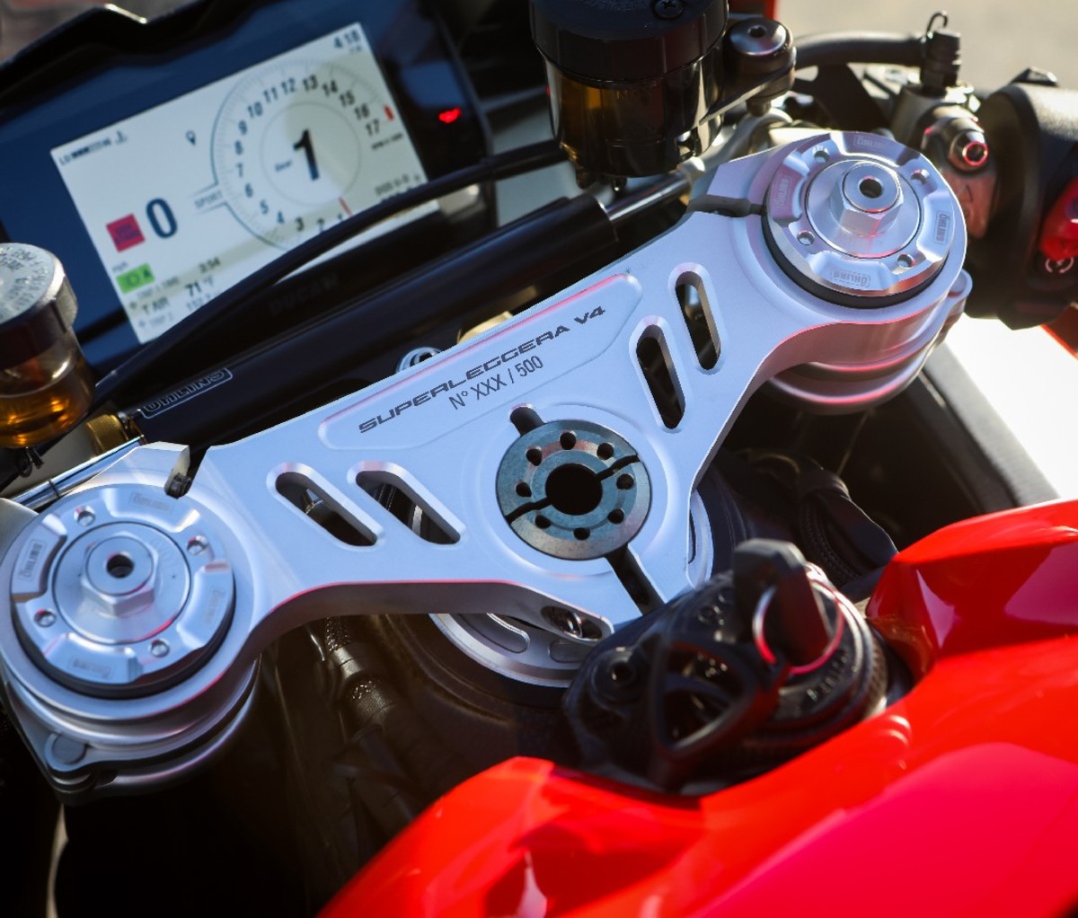 Closeup of dashboard of a red 2021 Ducati Superleggera V4 motorcycle