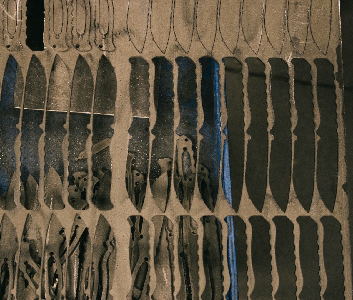 Rows of steel knife cutouts