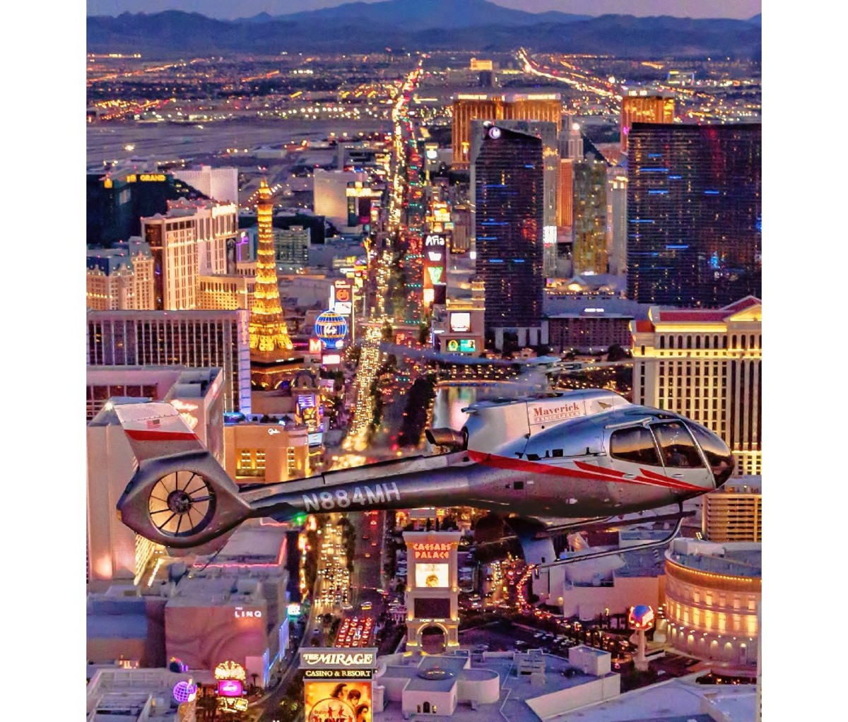 Helicopter hovering above the lights of the Vegas Strip at night