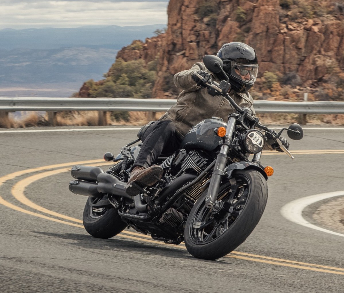 Rider turning into a mountain road curve on a 2022 Indian Chief motorcycle