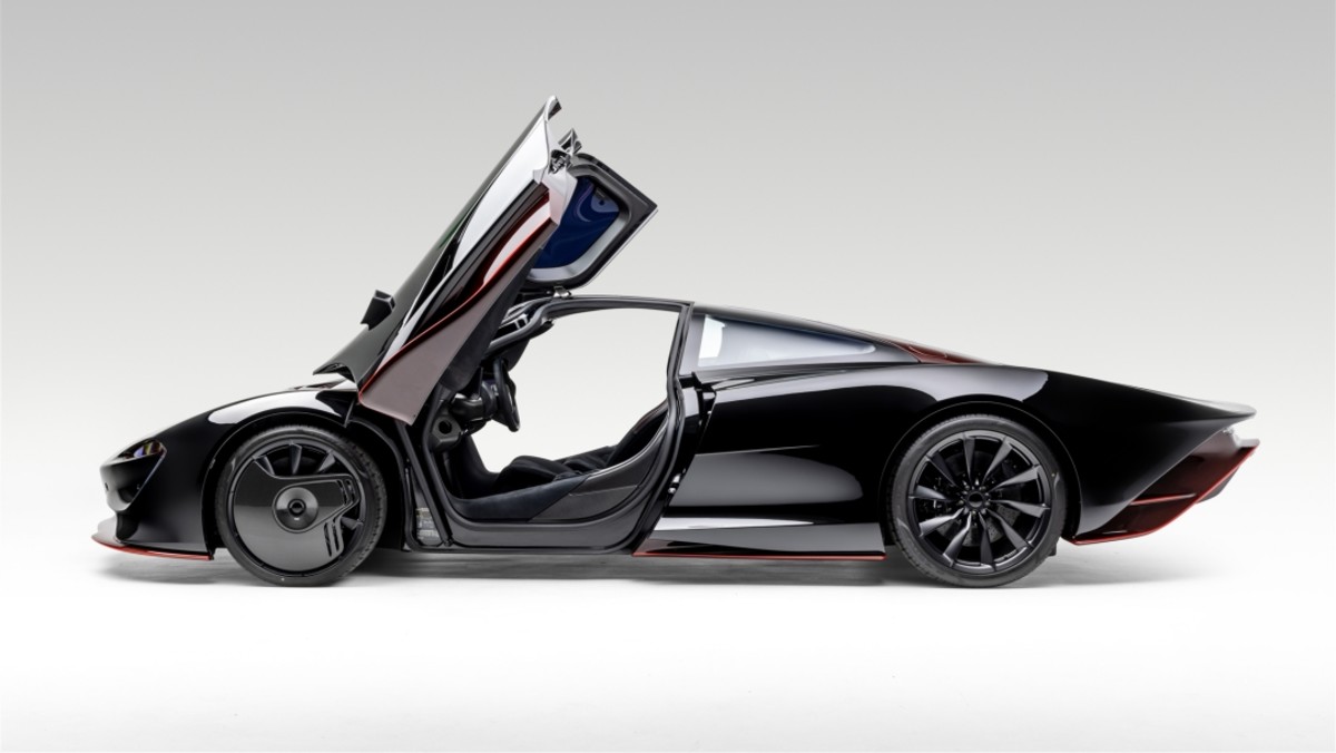 Black Mclaren Speedtail with its doors open hypercars