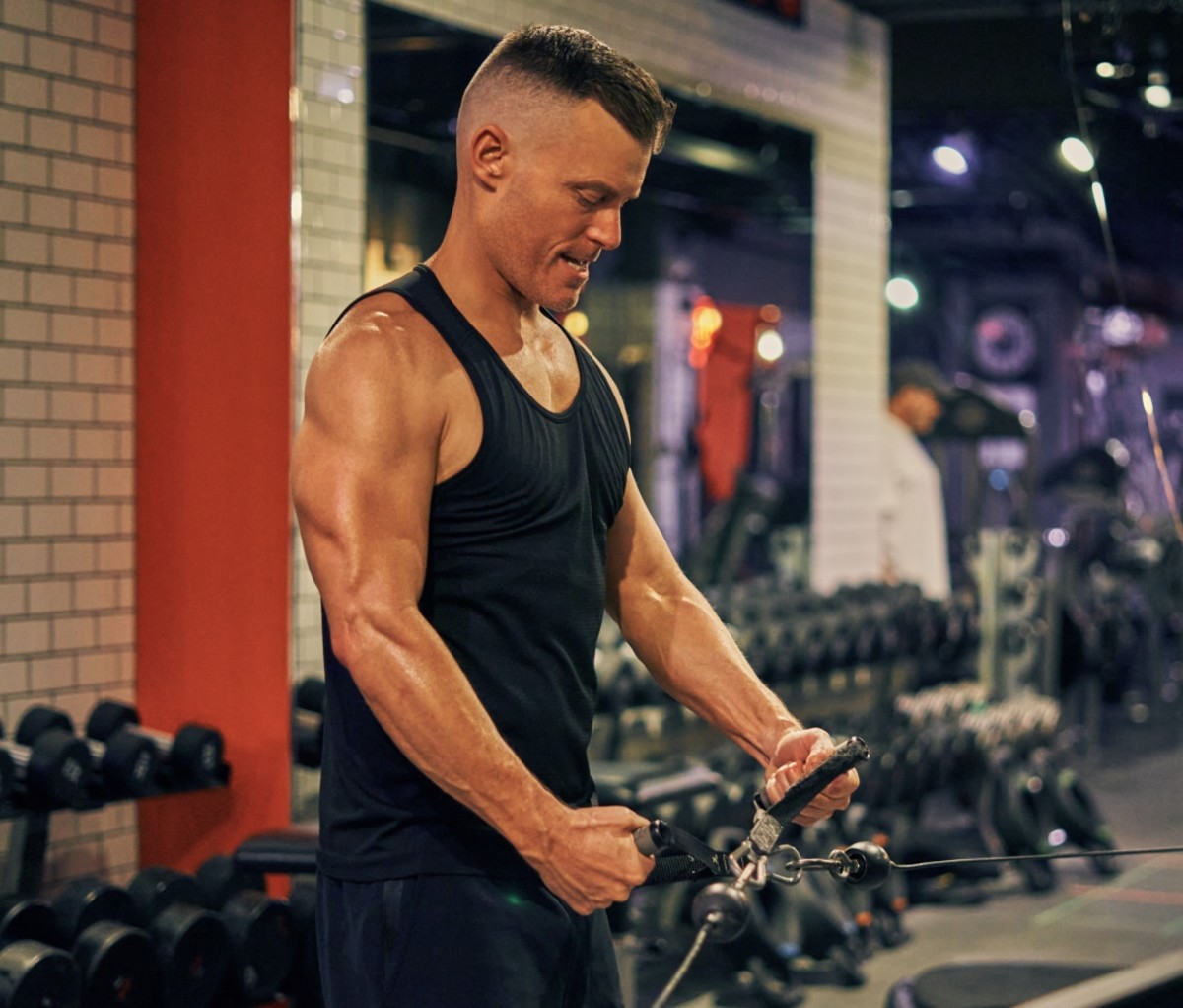 Rawson Thurber using a machine in the gym