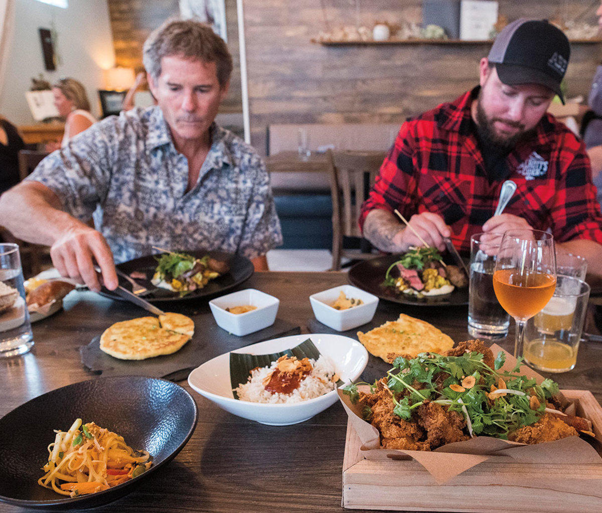 Men eating at brewery