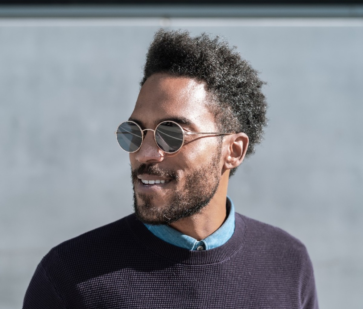 Black man wearing progressive glasses outdoors