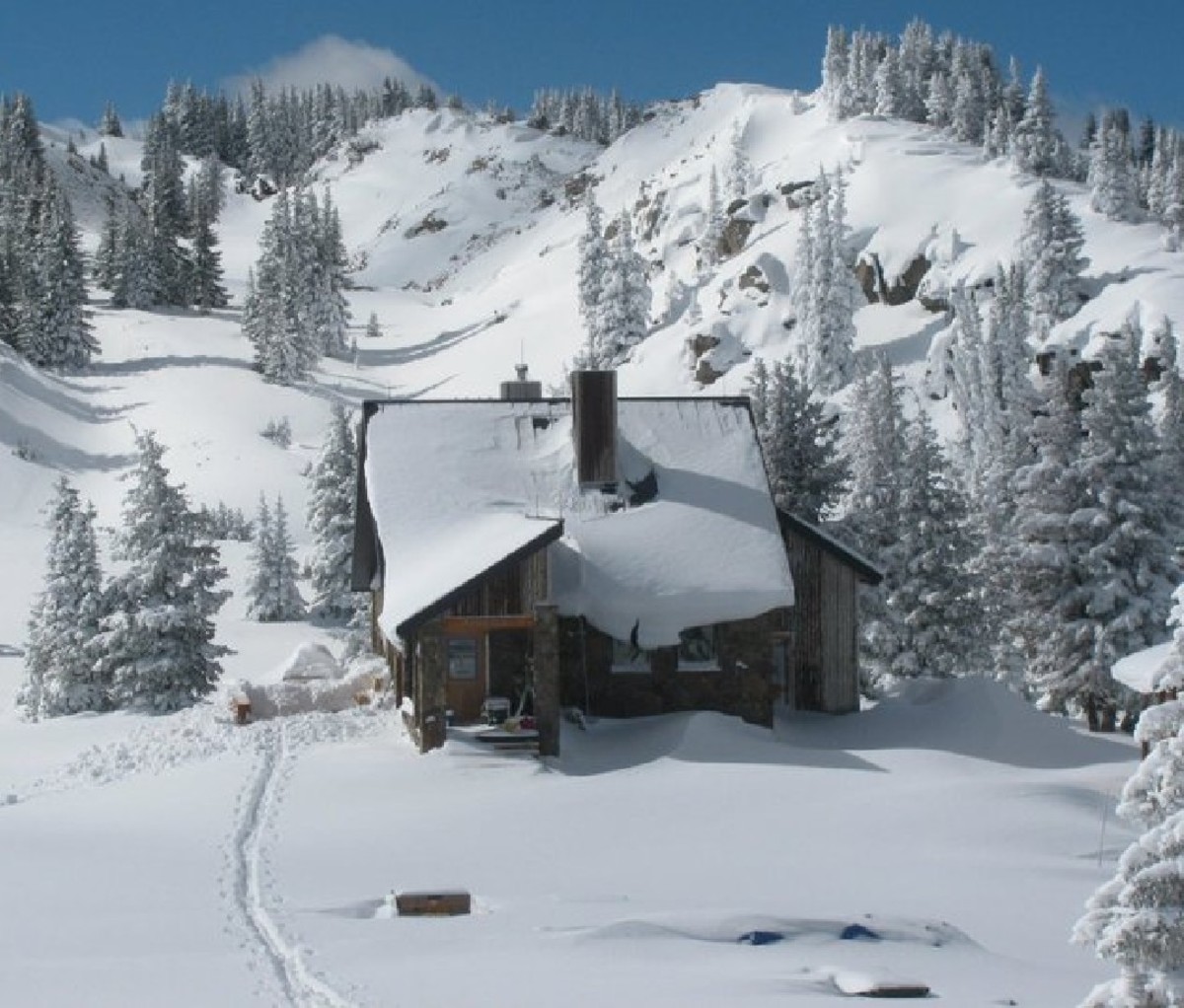 10th Mountain Division's Fowler/Hilliard Hut perched on a snowy mountainside in Colorado