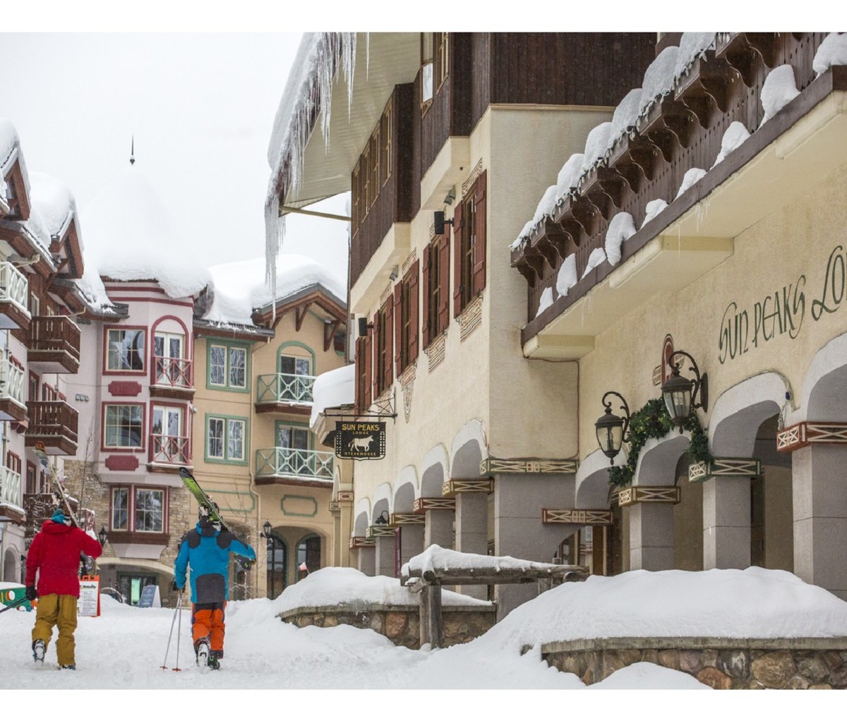 Skiiers walking through the village at Sun Peaks Resort