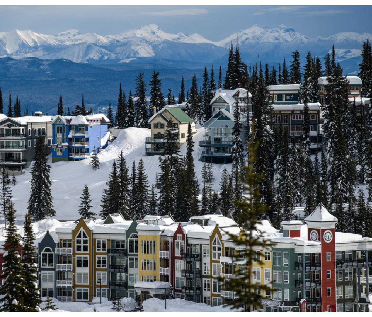 Chalets at SilverStar Mountain Resort with the Monashee Mountains in the distance.