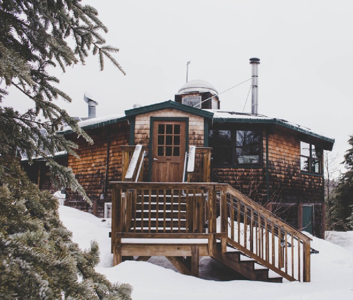Snowy image of Lonesome Lake Hut in the Appalachian Mountain Club hut system