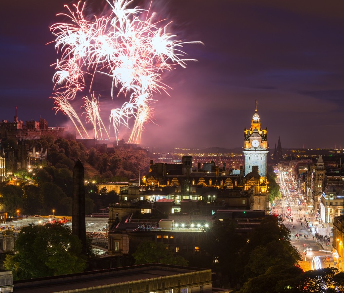 Fireworks over Edinburgh Castle and The Balmoral clock tower.